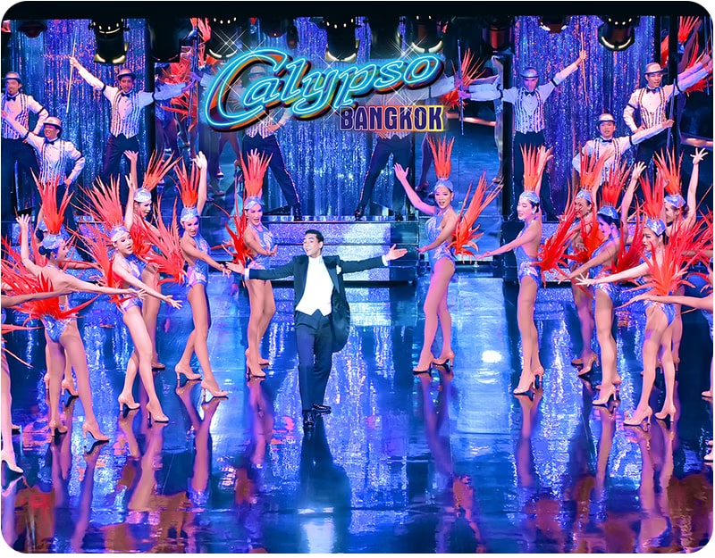 Performers in vibrant costumes light up the stage at Calypso Cabaret in Thailand, where visitors can enjoy spectacular dance shows at one of Bangkok's most renowned entertainment venues