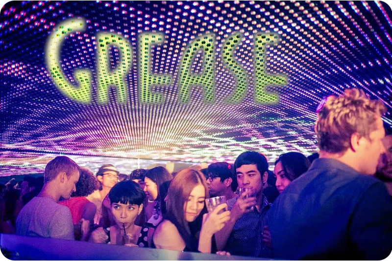 Among Thailand's popular tourist places, Grease Nightclub attracts visitors with its colorful LED ceiling and lively dance floor atmosphere