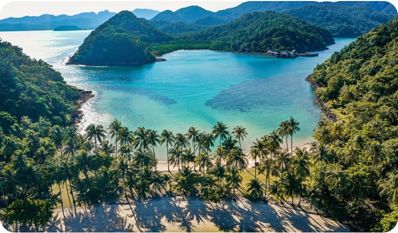 Crystal-clear waters and lush greenery at Koh Chang, a popular tourist destination in Thailand.