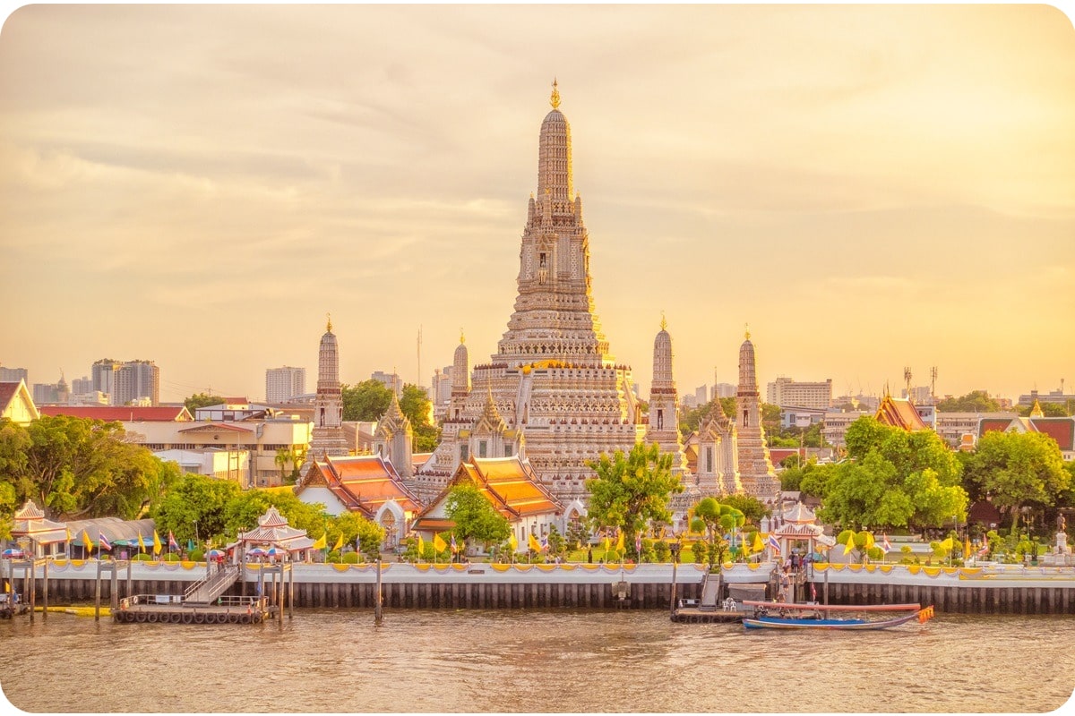 Wat Arun temple in Bangkok during sunset, a stunning landmark and top place to visit in Thailand.