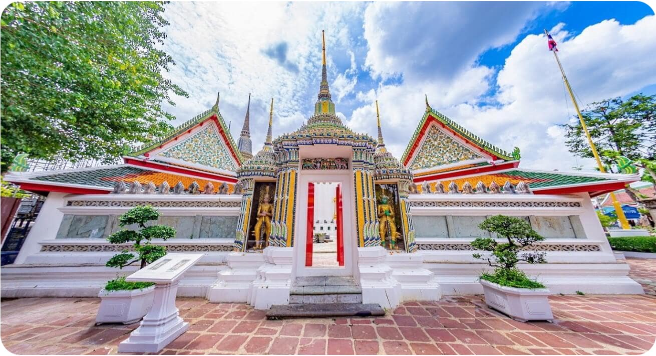 A view of the beautiful architecture at Wat Pho, a popular tourist destination in Thailand.